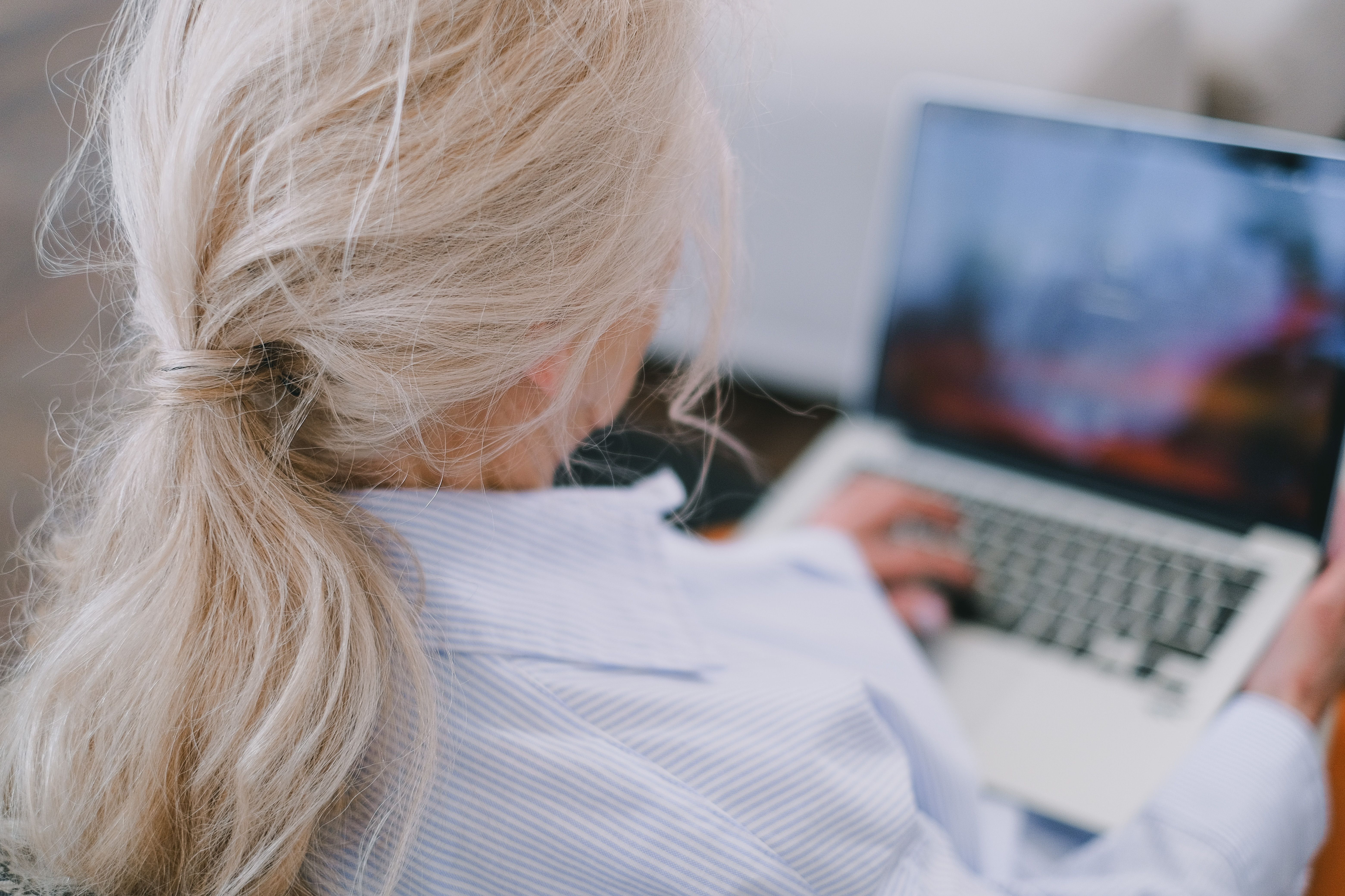Wendy Baunton working at a laptop